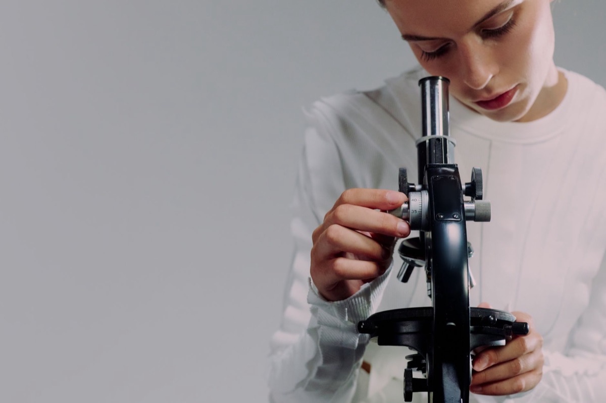 A close-up of a laboratory microscope used for veterinary research and studies.